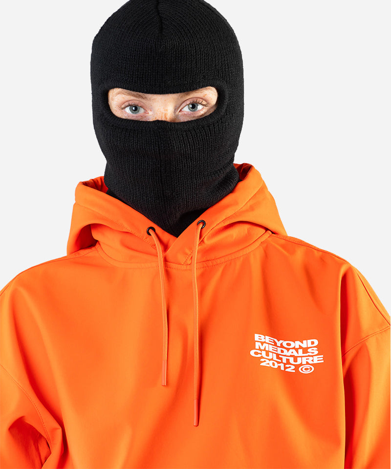 BeyondMedalsSoftshellHoodieOrange-CloseupWoman