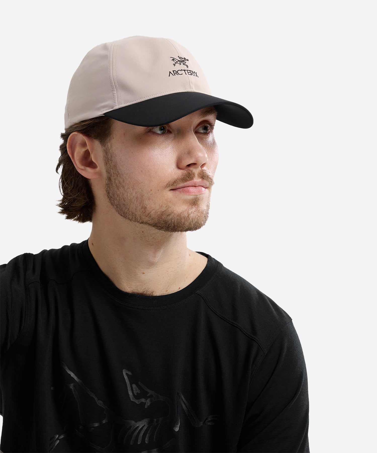 Arc_teryxBirdWordCapRuneBlack-ModelSide_6f0c92a8-0bef-47a4-8d51-8792335f1da5