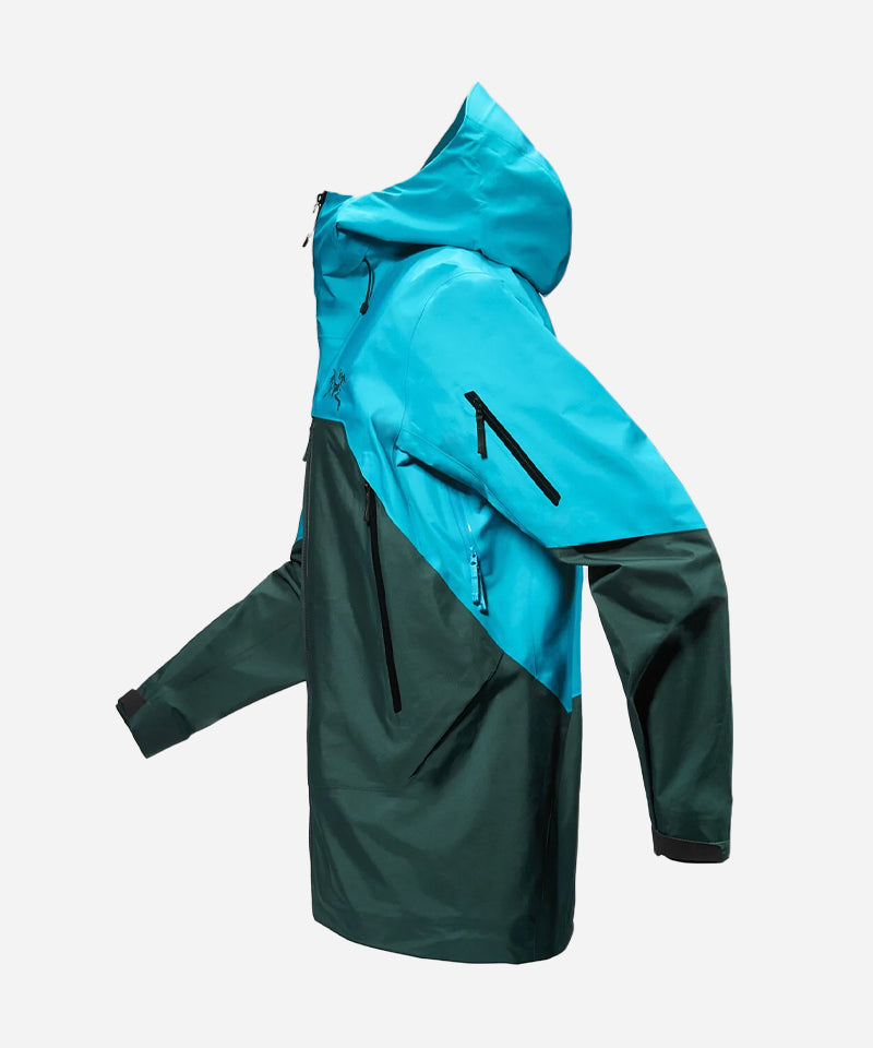 The Arc'teryx Rush Jacket Blue Tetra shown from the side.