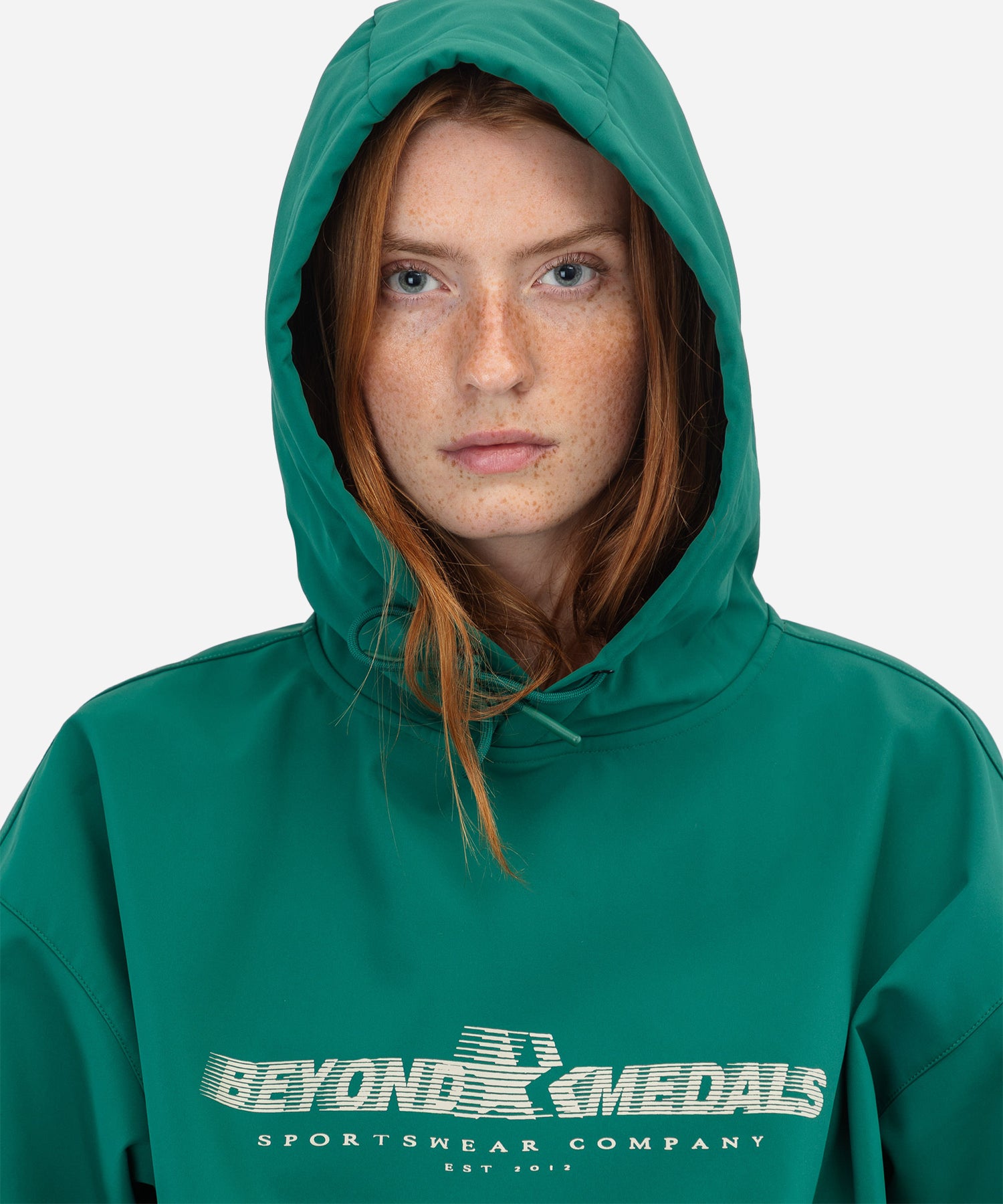 BeyondMedalsSoftshellHoodieGreen-ModelFrontWoman_d4fa9d2d-eeee-4c47-b9e1-dc77ebcb5b84