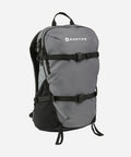 A gray and black Burton backpack with two black compression straps and a white Burton logo on the front, shown against a light gray background.