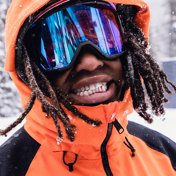 Person wearing Smith goggles in the snow, and a link to shop Smith Helmets and Goggles.